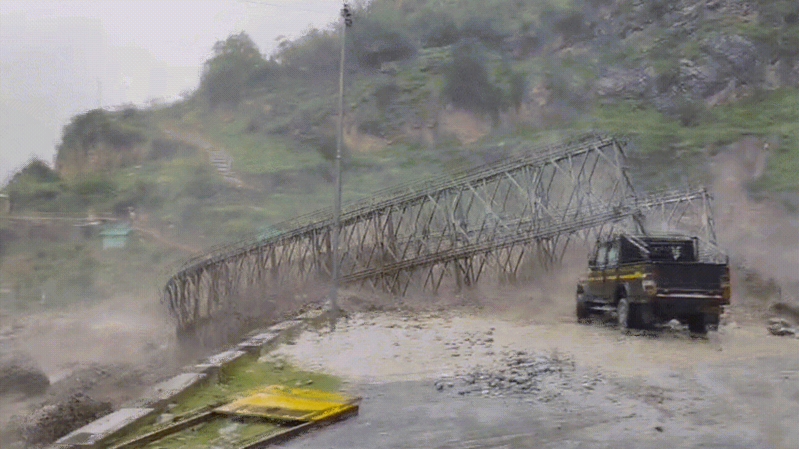 Metal bridge ripped apart by swollen river after flash flood in Uttarakhand's Chamoli | Watch