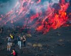 Hikers watch as molten lava spews from Mount Etna – video